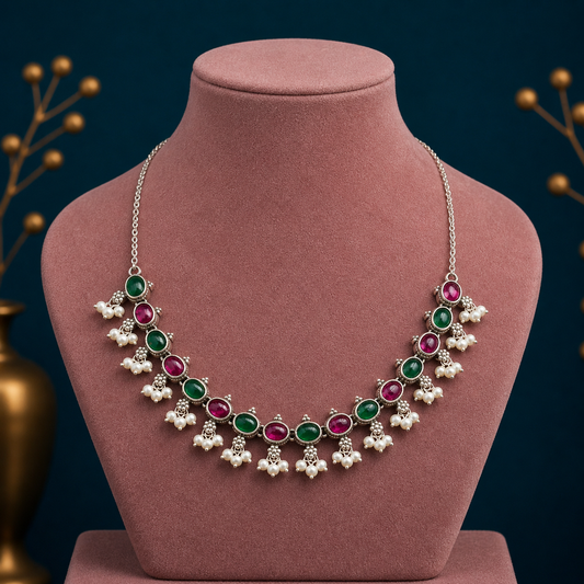 Sterling silver necklace with red and green stones, pearls, and intricate handmade design by Tribal Ornaments for stylish jewelry.