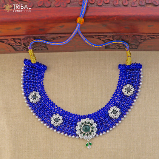 Silver blue Indian traditional choker necklace set with intricate cultural design from TRIBAL ORNAMENTS, featuring matching earrings.