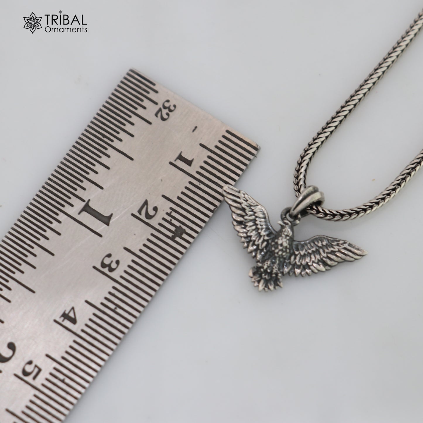 925 sterling silver eagle bird pendant with chain, tribal jewelry design showcasing detailed craftsmanship and bold style.