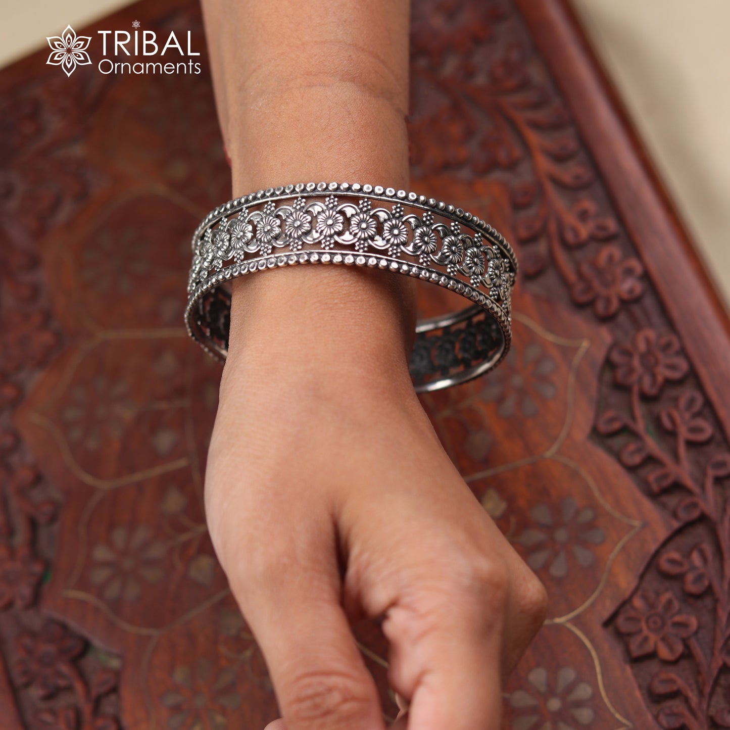 Sterling silver floral design bangle kada jewelry with intricate ethnic detailing, crafted by TRIBAL ORNAMENTS.