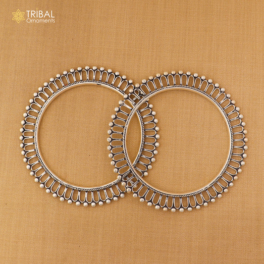 Sterling silver sun-inspired design bangle kada from TRIBAL ORNAMENTS, featuring ethnic jewelry style with intricate details.