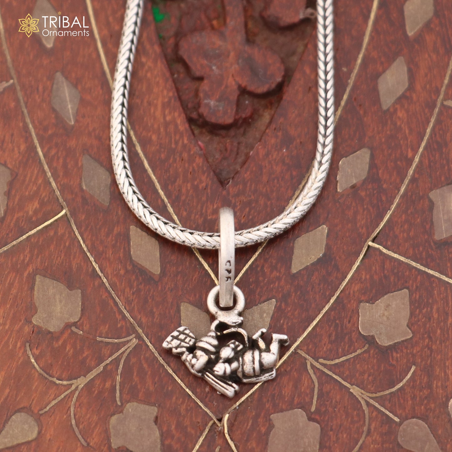 Sterling silver Flying Hanuman Ji pendant with chain, tribal jewelry piece showcasing detailed craftsmanship and religious symbolism.