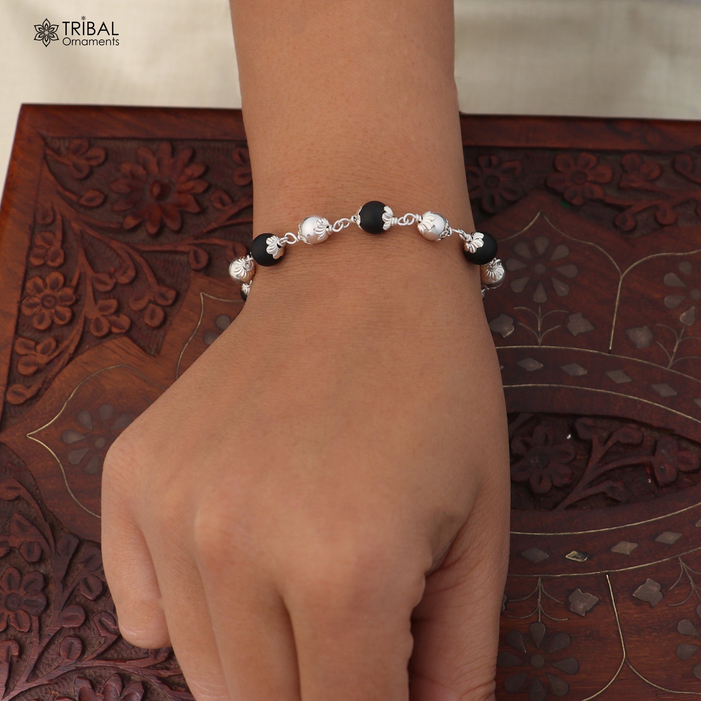 Sterling silver and black beaded unisex bracelet with Karungali beads from TRIBAL ORNAMENTS, featuring a stylish, handcrafted design.