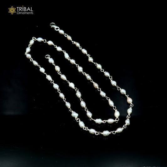 Sterling silver pearl beads necklace by TRIBAL ORNAMENTS featuring white pearls and silver chain, close-up of elegant jewelry design.