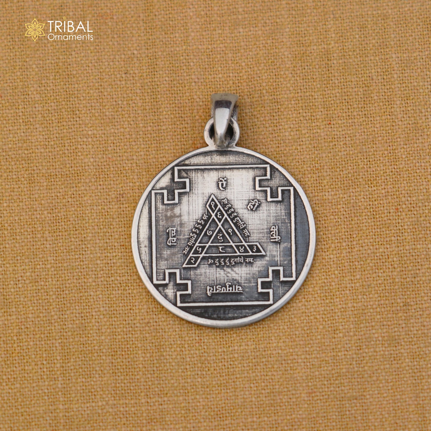 Sterling silver Durga Bisa Yantram pendant with chain, tribal jewelry featuring intricate design and traditional craftsmanship.