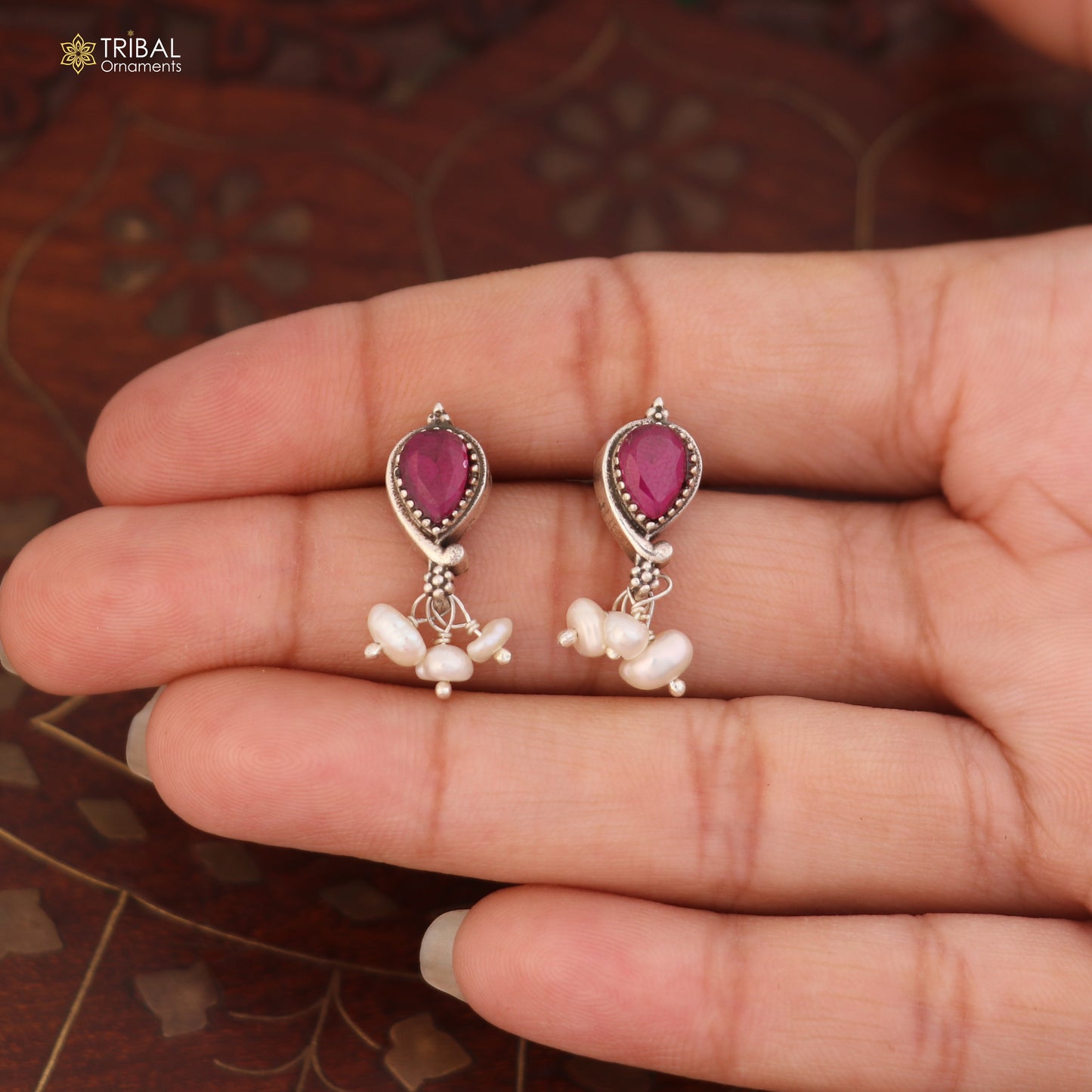 Sterling silver ethnic jewelry set with ruby red and green cut stones, includes necklace and earrings by TRIBAL ORNAMENTS.