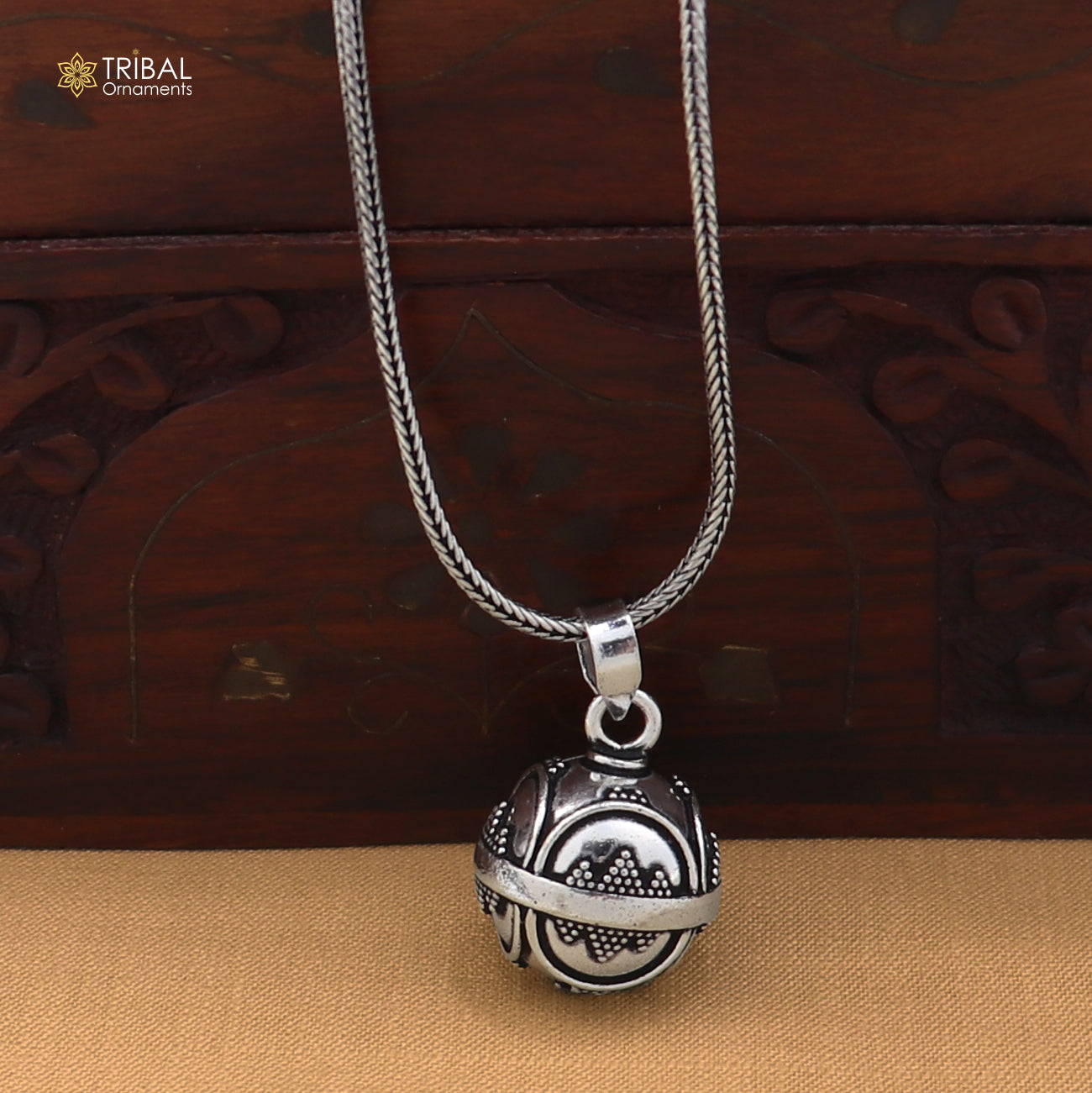 Sterling silver ball design pet cat/dog jingling pendant with tribal jewelry style, featuring intricate details and a shiny finish.
