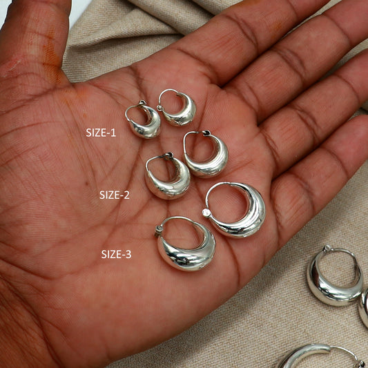 Sterling silver plain hoop earrings in various sizes with Bali tribal design by TRIBAL ORNAMENTS, showcasing smooth, polished surfaces.