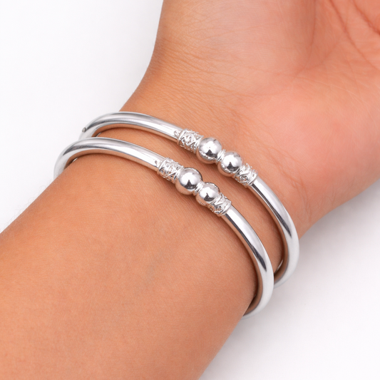 Sterling silver ball design bangle bracelet for girls by TRIBAL ORNAMENTS, featuring a plain, smooth, minimalist jewelry style.
