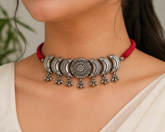 Sterling silver tribal choker necklace with flower design and ethnic charm, showcasing intricate tribal jewelry details.