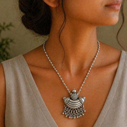 Sterling silver tribal temple pendant from TRIBAL ORNAMENTS with intricate ethnic design and traditional Indian craftsmanship.