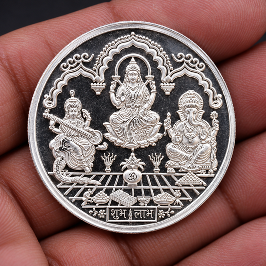 Silver Indian idol coin featuring Lord Ganesha, Laxmi, and Saraswati print, 20 grams, collectible and ideal for gifting.