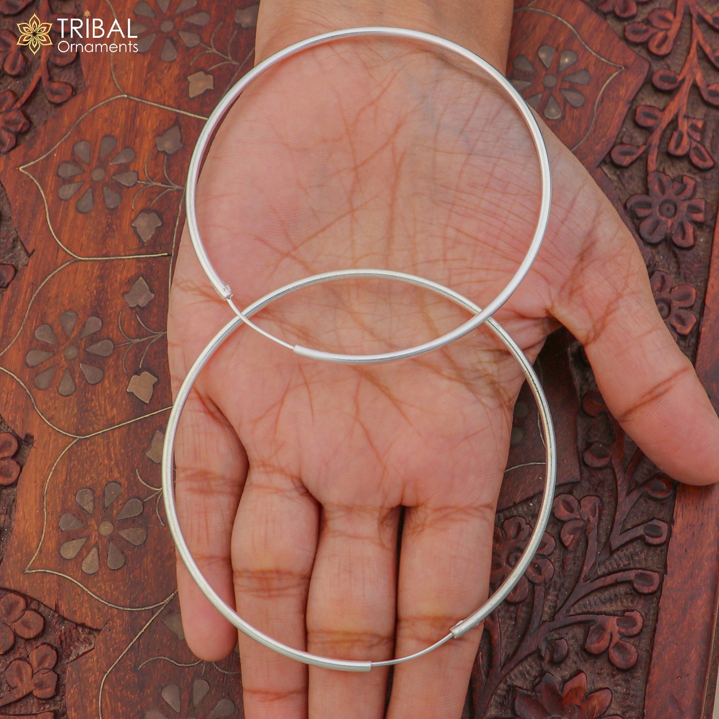 Sterling silver round hoops earrings by Tribal Ornaments, showcasing elegant, polished jewelry design for stylish accessories.