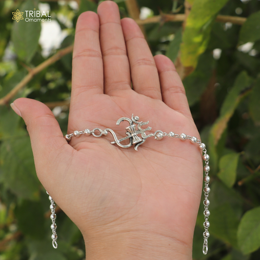 Sterling silver Om Rudraksha and Tulsi beads bracelet with black and white accents, handcrafted tribal jewelry for spiritual adornment.