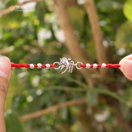 Handmade 925 sterling silver Shree Ganesha design bracelet thread Rakhi by TRIBAL ORNAMENTS, featuring intricate Ganesha motifs.