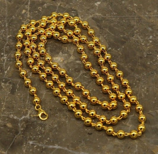 Sterling silver handmade beaded necklace with gold polish, stylish unisex jewelry by TRIBAL ORNAMENTS, perfect for gifting.