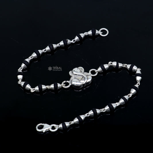 925 sterling silver Lord Ganesha beaded bracelet with black Tulsi beads, handmade tribal ornament design for spiritual wristwear.