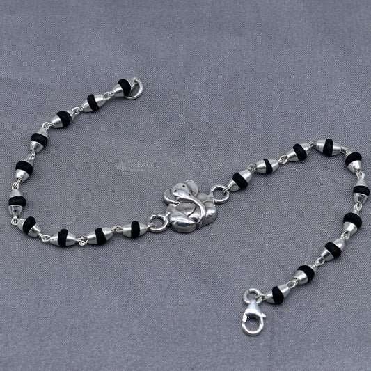 Sterling silver Lord Ganesha bracelet with black Tulsi beaded design and handmade Ganesha motif, from Tribal Ornaments.