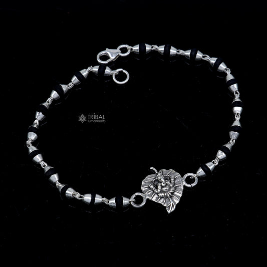 Sterling silver Lord Ganesha bracelet with black Tulsi beads and basil rosary beads, handcrafted by Tribal Ornaments.