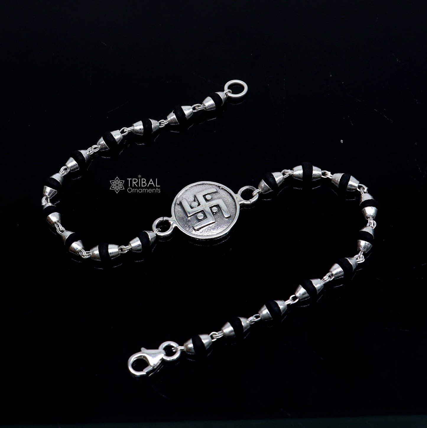 Sterling silver Swastik design black Tulsi beads bracelet with holy basil beads, crafted by TRIBAL ORNAMENTS.