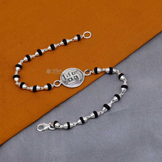 Sterling silver Swastik design black Tulsi beads bracelet with holy basil beads, crafted by TRIBAL ORNAMENTS.