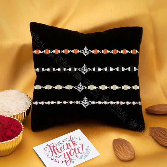 Sterling silver Lord Ganesha design Rudraksha beaded bracelet rakhi with handmade craftsmanship by TRIBAL ORNAMENTS.