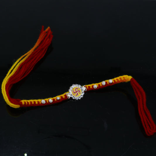 925 sterling silver SWASTIKA design thread rakhi bracelet by TRIBAL ORNAMENTS, featuring a traditional pendant for Rakshabandhan.