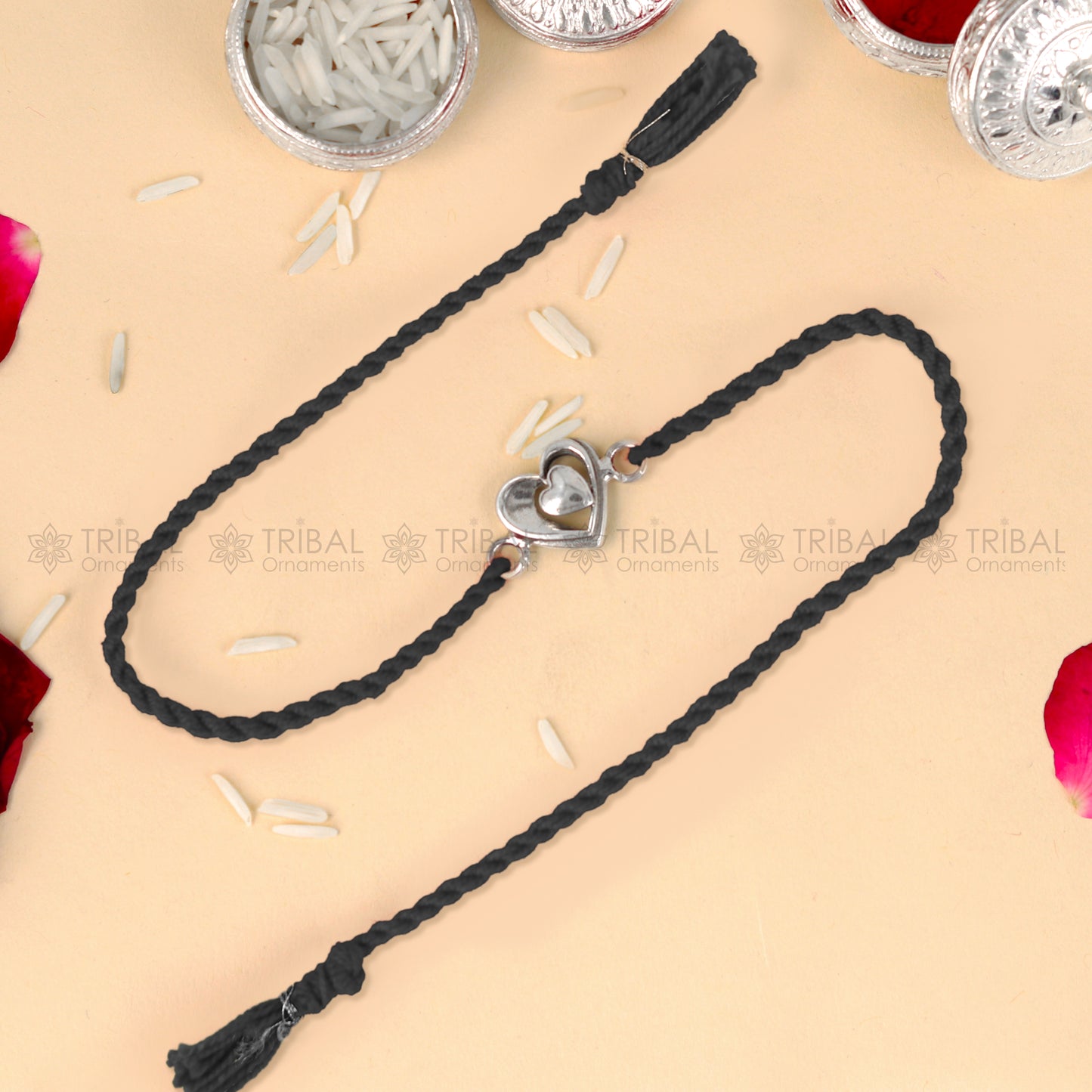 925 Sterling silver heart design thread rakhi bracelet with red thread and pendant from TRIBAL ORNAMENTS, stylish and traditional.