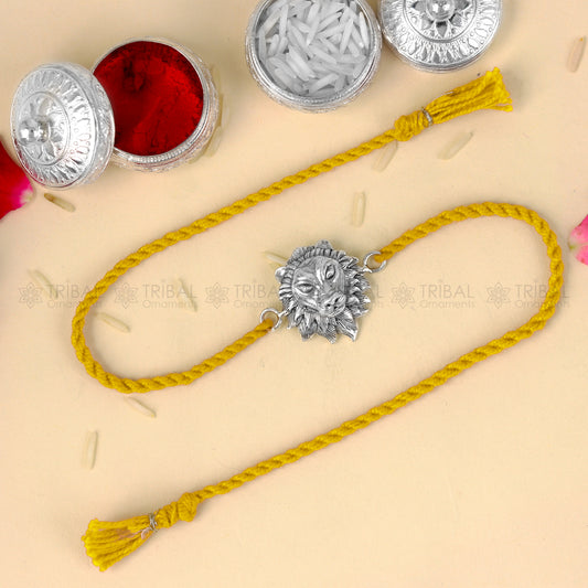 Sterling silver lion face design thread rakhi bracelet with red thread from TRIBAL ORNAMENTS, ideal for Rakshabandhan festival.