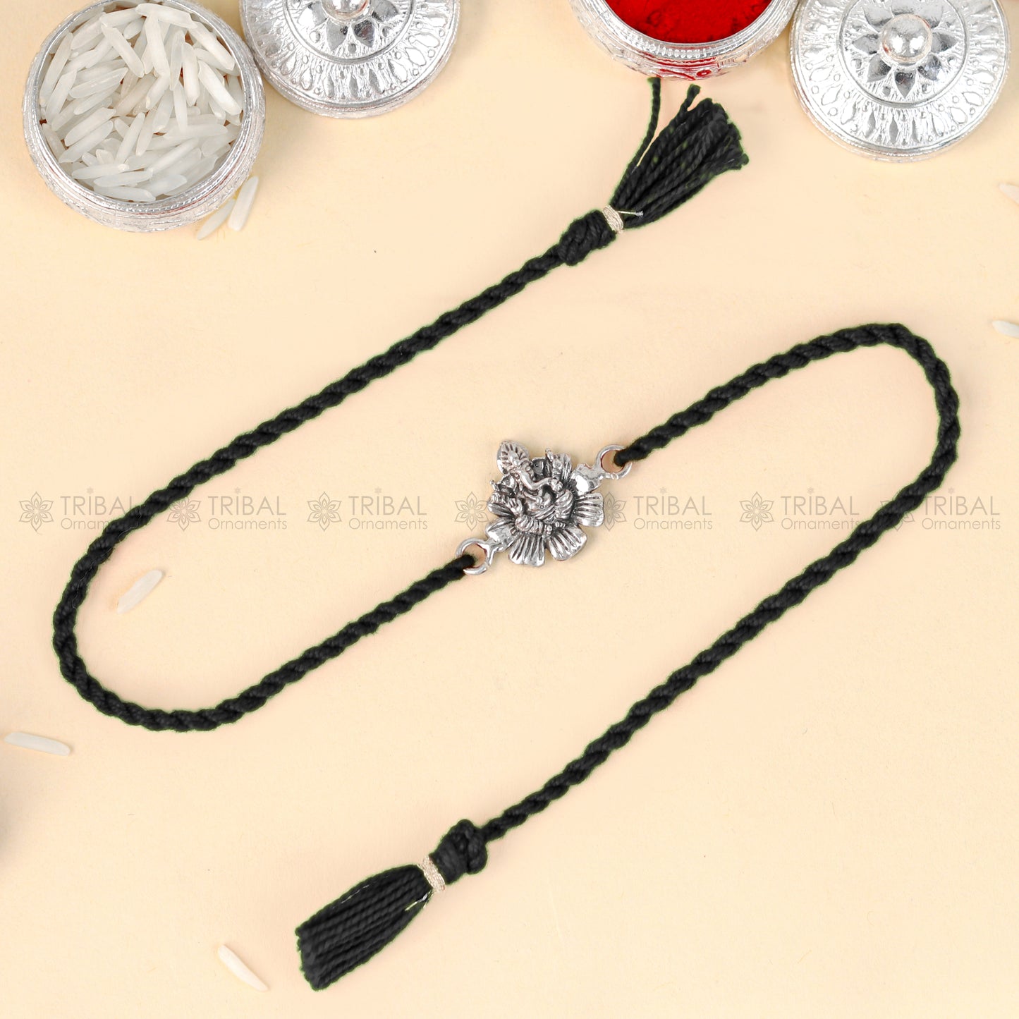 Sterling silver Lord Ganesha pendant bracelet with red thread, handcrafted by TRIBAL ORNAMENTS.
