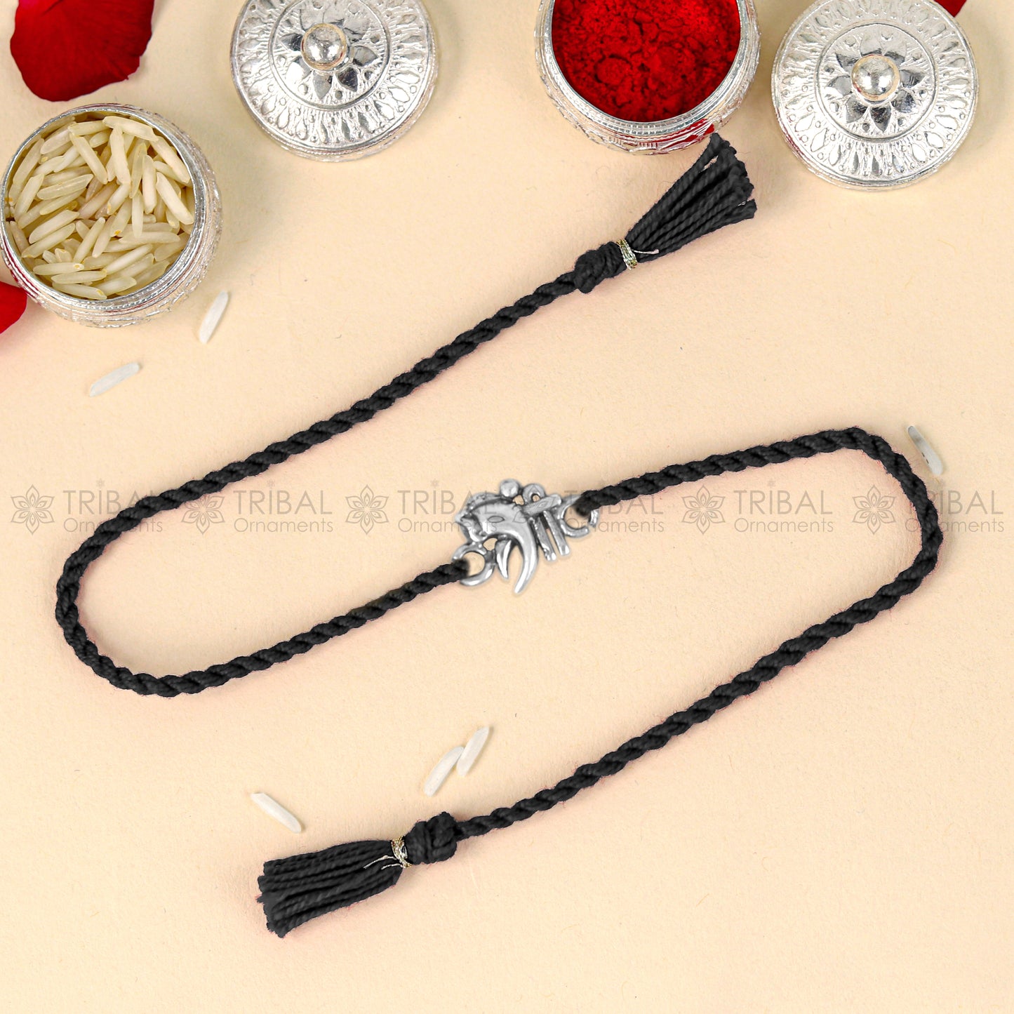 Sterling silver Lord Ganesha design thread bracelet with red thread, featuring intricate Ganesha pendant, by TRIBAL ORNAMENTS.