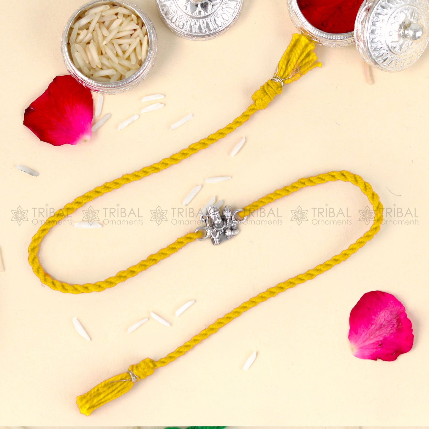 Sterling silver Lord Hanuman design thread rakhi bracelet with red thread from Tribal Ornaments, featuring detailed pendant.