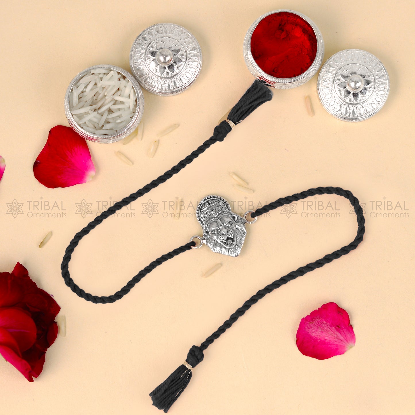 Sterling silver Narsimha design thread bracelet with red thread and pendant, crafted by TRIBAL ORNAMENTS.