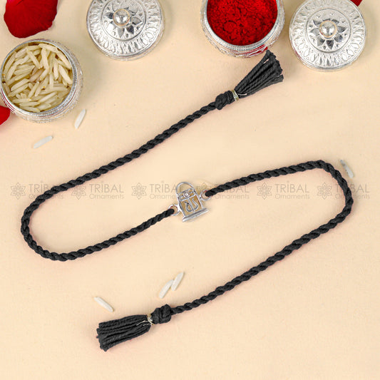 Sterling silver Siva Lingam design thread bracelet with red thread, crafted by Tribal Ornaments for spiritual elegance.