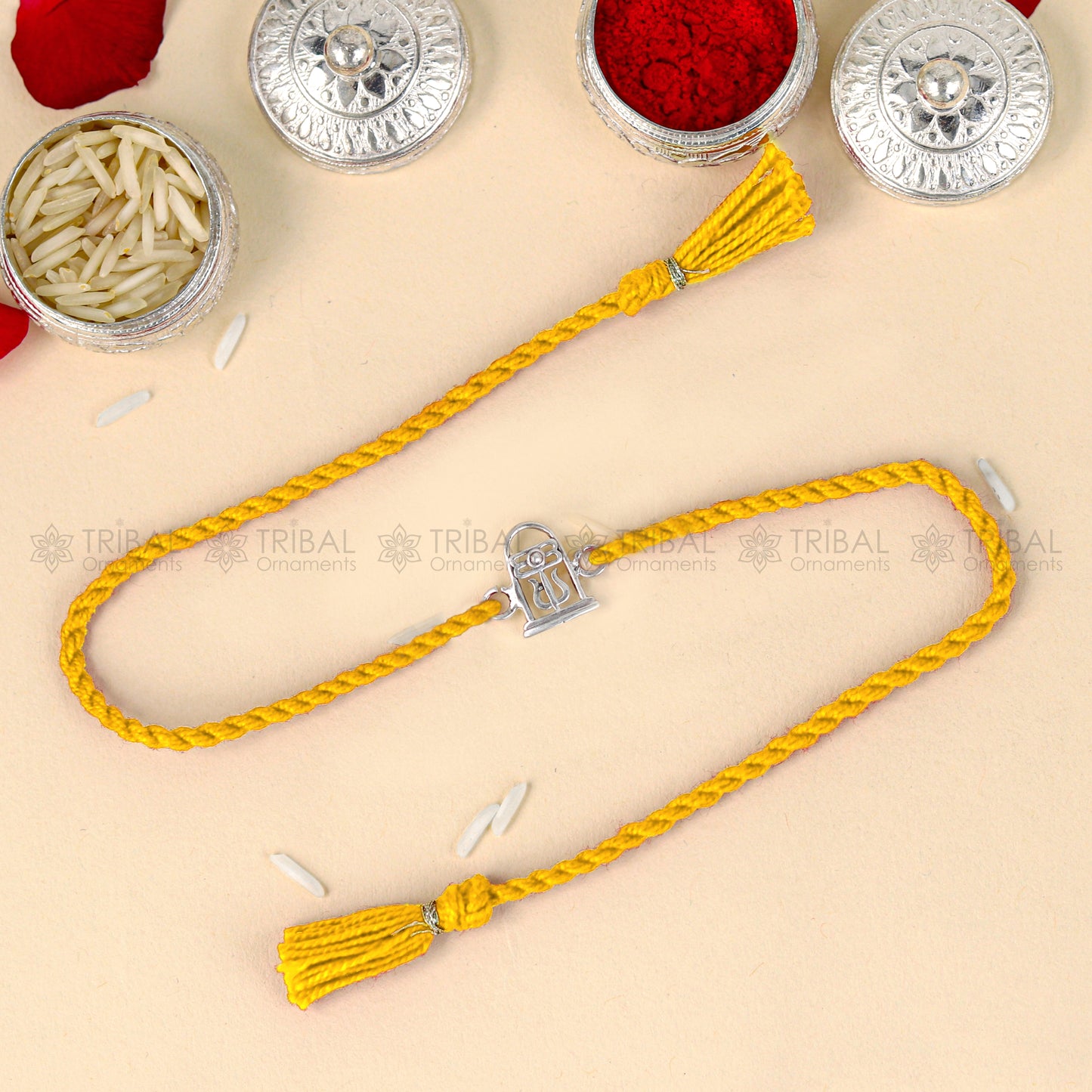 Sterling silver Siva lingam design thread bracelet with red thread, handcrafted by TRIBAL ORNAMENTS.