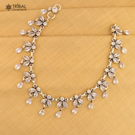 Sterling silver 10-inch flower-design anklet with white stones, featuring intricate tribal ornament details for stylish ankle jewelry.