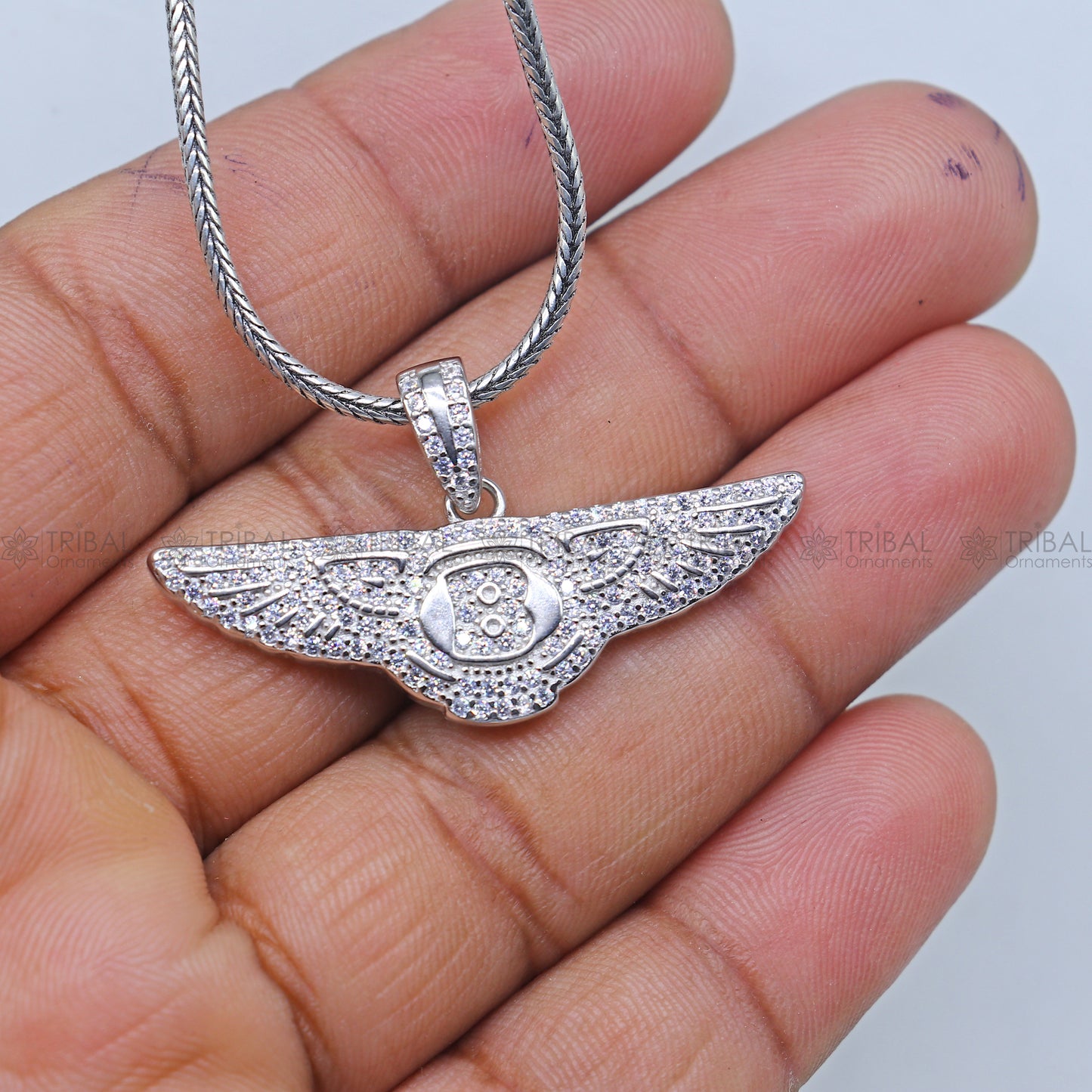 925 Sterling silver Bentley Motors logo pendant by TRIBAL ORNAMENTS, featuring a detailed Bentley emblem pendant.