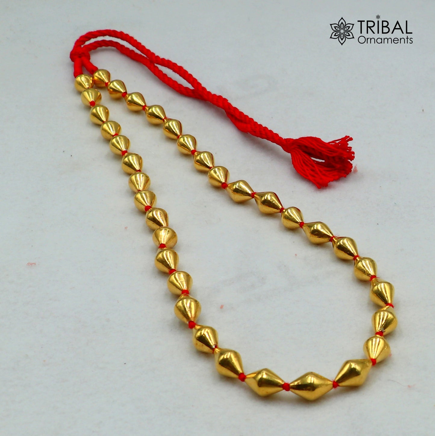 925 sterling silver gold-polished dholki beaded necklace from tribal jewelry set with intricate tribal bead design and traditional style.