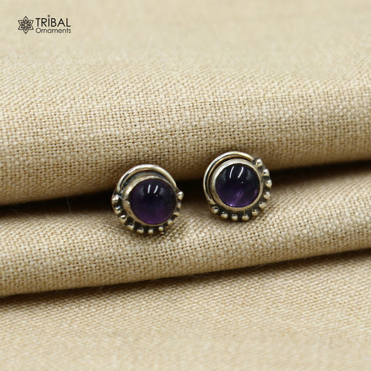 Sterling silver round amethyst stud earring from TRIBAL ORNAMENTS, unisex jewelry with vibrant purple gemstone.