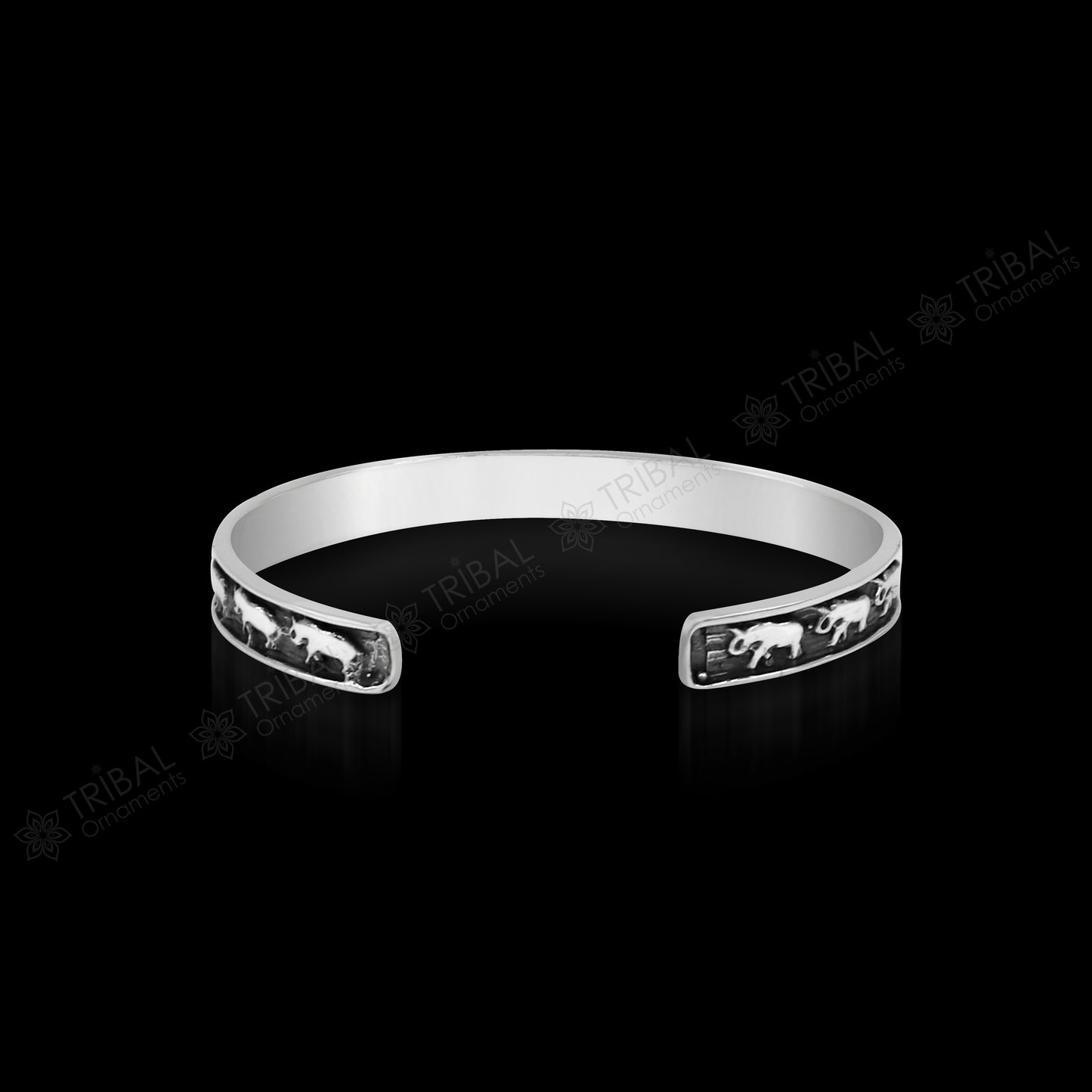 Sterling silver elephant design bangle cuff bracelet by TRIBAL ORNAMENTS, open-face with wavy details, unisex jewelry, gift-ready.