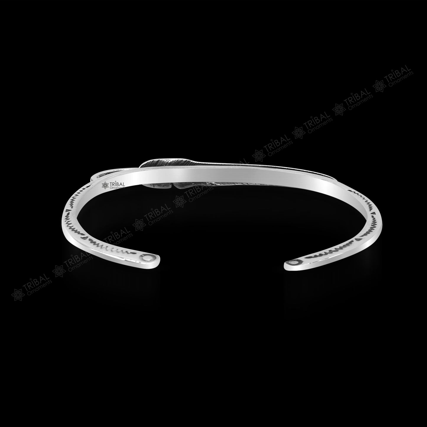 Adjustable 925 sterling silver feather design cuff bracelet by TRIBAL ORNAMENTS, unisex stylish jewelry with modern, trendy appeal.