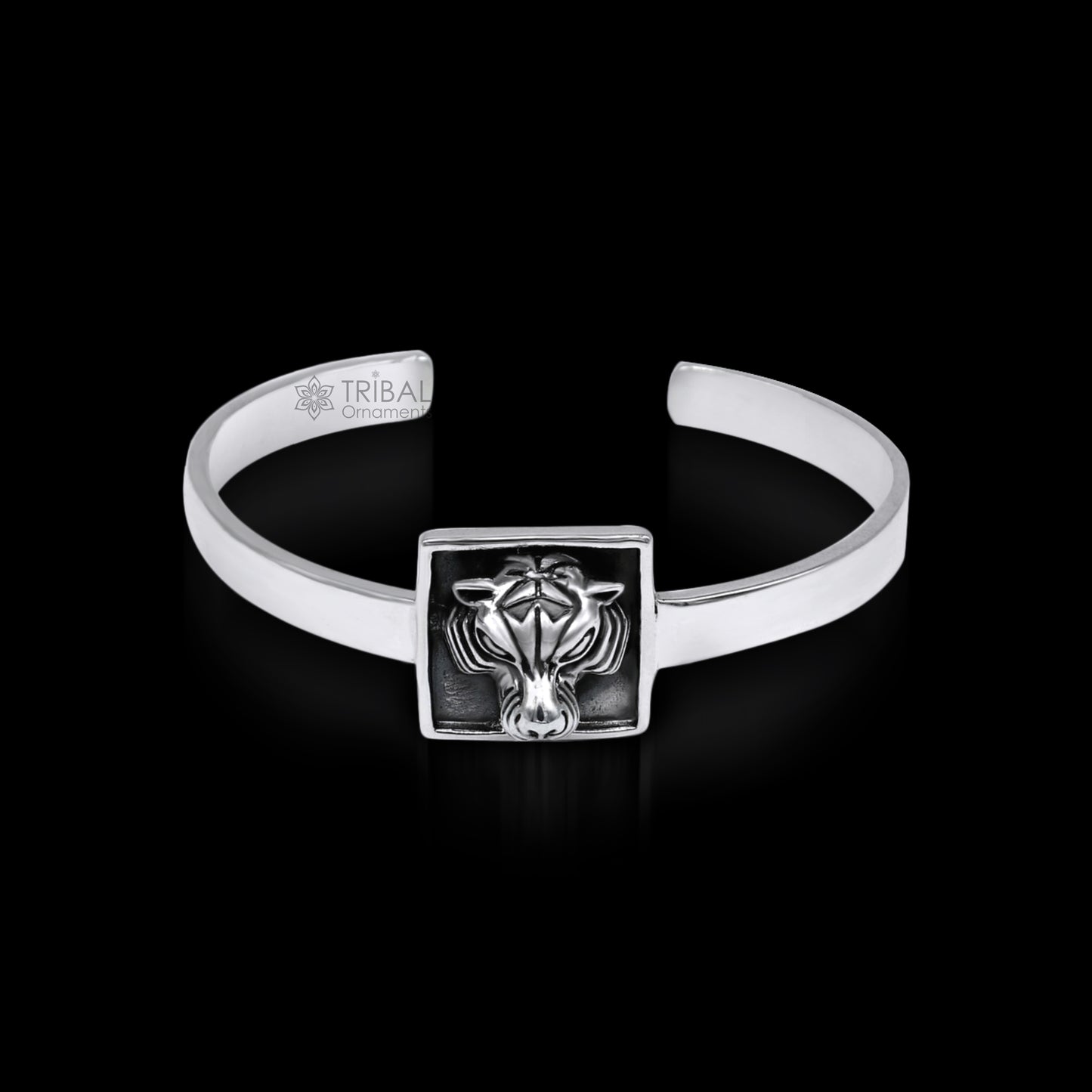 Sterling silver lion face design adjustable bangle cuff bracelet by TRIBAL ORNAMENTS, unisex ethnic jewelry with intricate detailing.