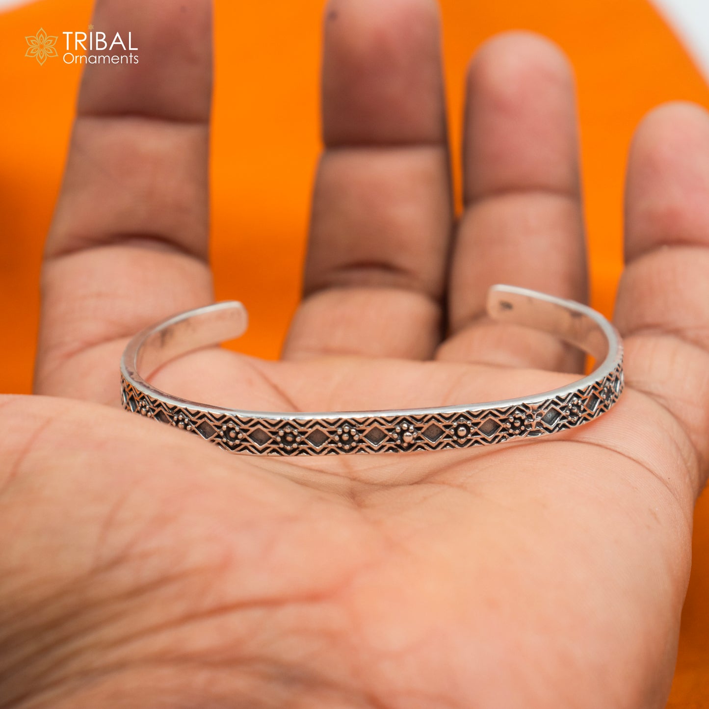 Stylish adjustable 925 sterling silver bangle cuff bracelet by TRIBAL ORNAMENTS, unisex jewelry with intricate handcrafted design.