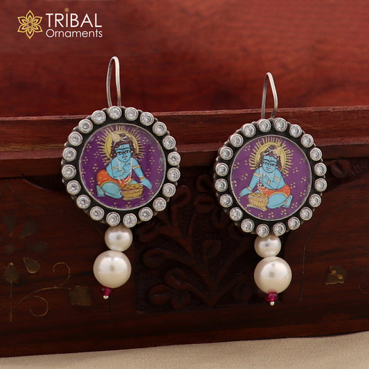 925 sterling silver Lord Krishna miniature art painting hoops earrings by TRIBAL ORNAMENTS featuring detailed Krishna design.