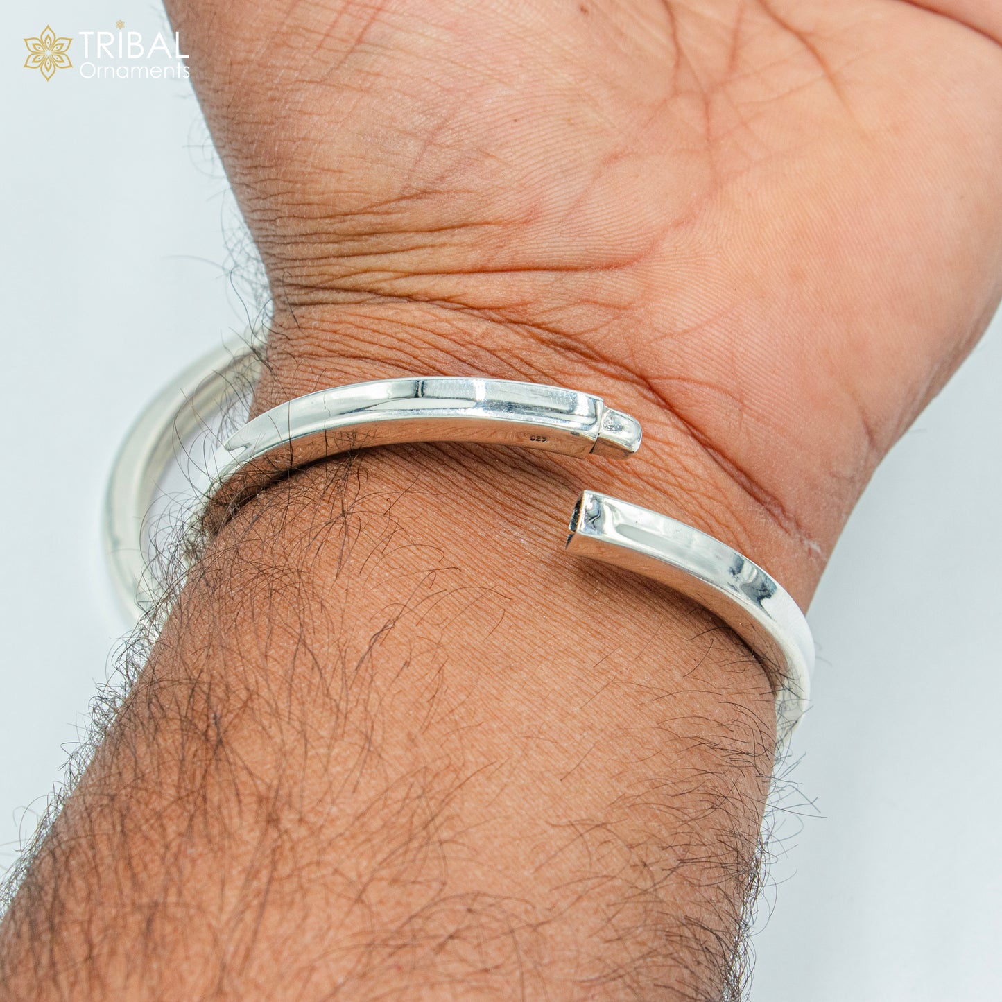 Unisex 925 sterling silver plain bangle bracelet with tribal design, featuring smooth, round edges and minimalist style.