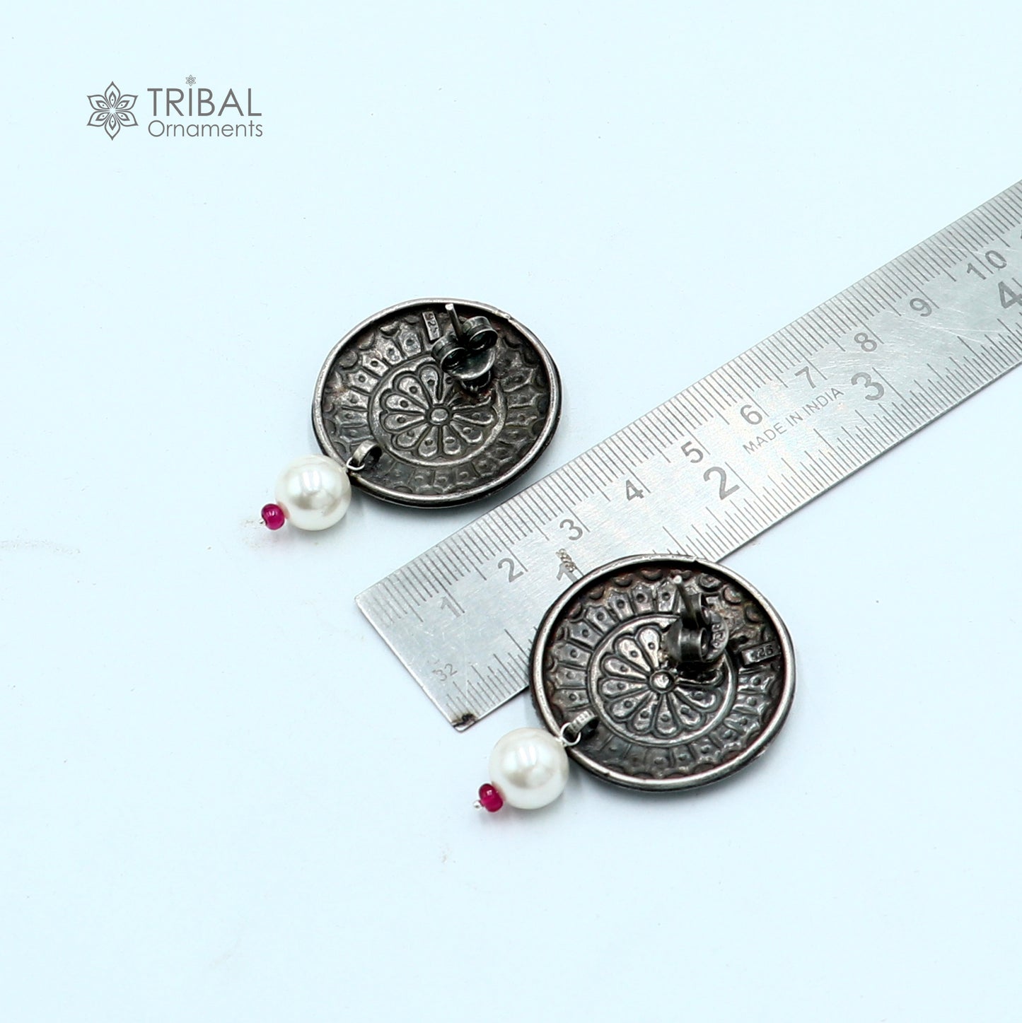 Vintage style round sterling silver traditional earring by TRIBAL ORNAMENTS, showcasing intricate tribal design.