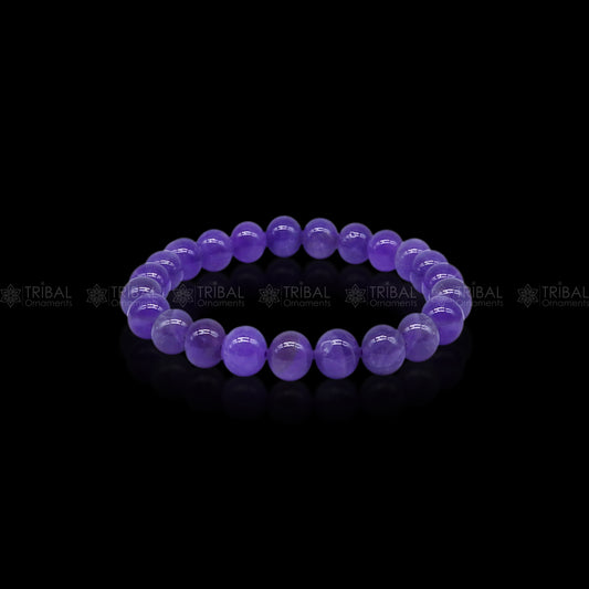 Amethyst bracelet by Tribal Ornaments featuring purple gemstone beads for calm and clarity, displayed on a neutral background.