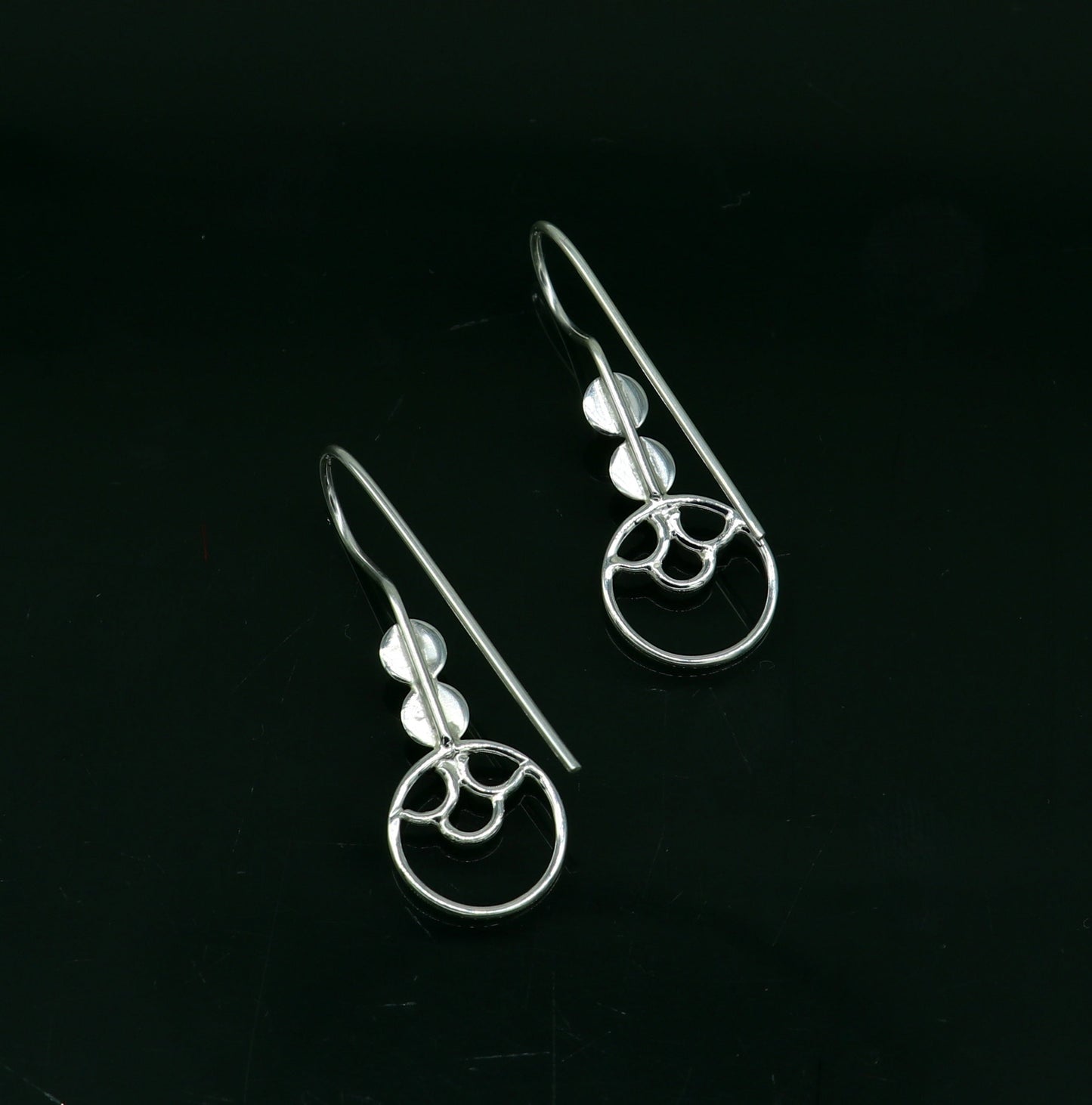Sterling silver handmade circle hoop earring by TRIBAL ORNAMENTS, stamped 925, stylish design, perfect for gifting or fashionable wear.