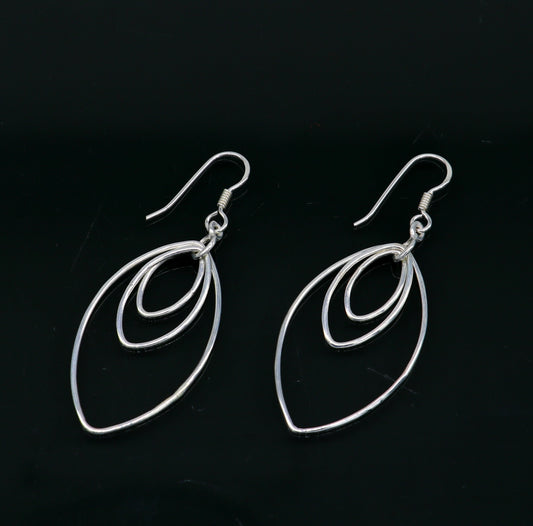 Sterling silver handmade eclipse-style hoop earring with geometric drop dangle, elegant and trendy jewelry from TRIBAL ORNAMENTS.