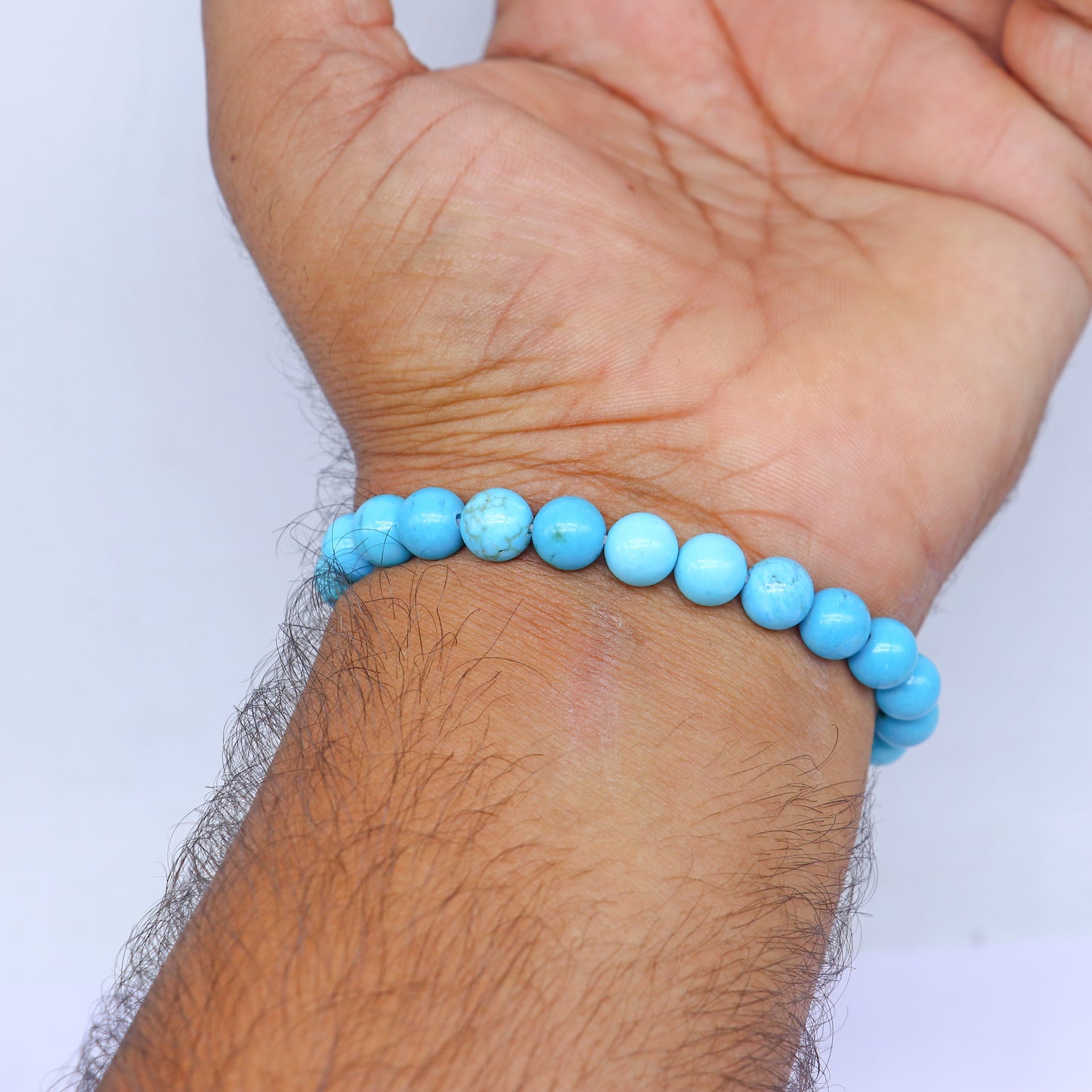 Turquoise crystal bracelet by TRIBAL ORNAMENTS featuring vibrant beads and a protective, healing design.